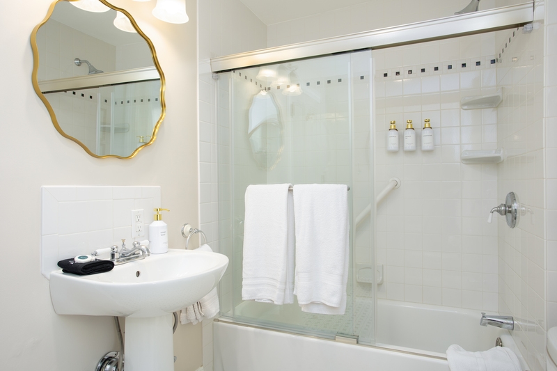 bathroom with tub and shower