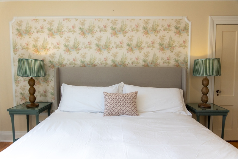 spacious room with king bed, flat screen tv, ceiling fan