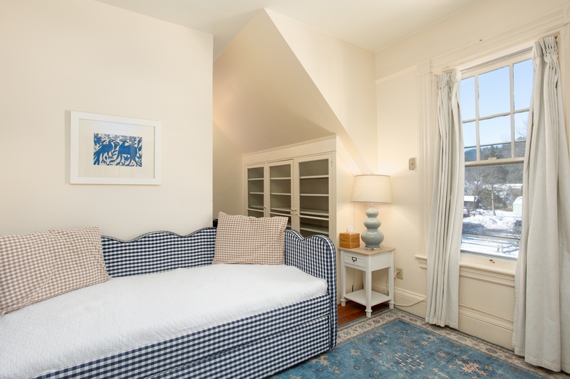 small room with tv and daybed