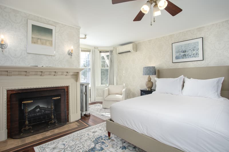 spacious room with plush bed and cozy rug