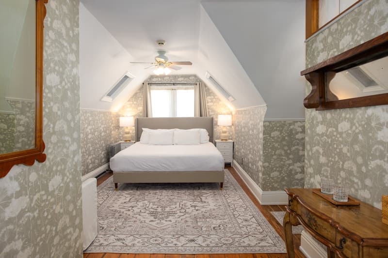 spacious room with plush bedding