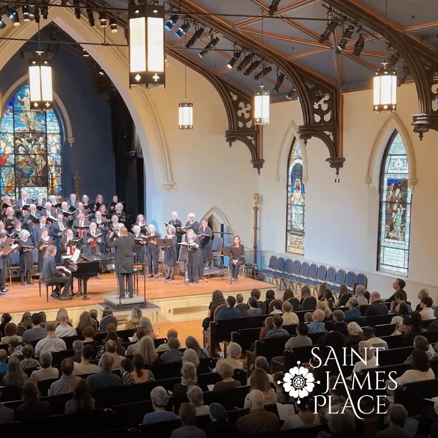 A choir performs in a beautifully adorned church while an audience listens attentively.