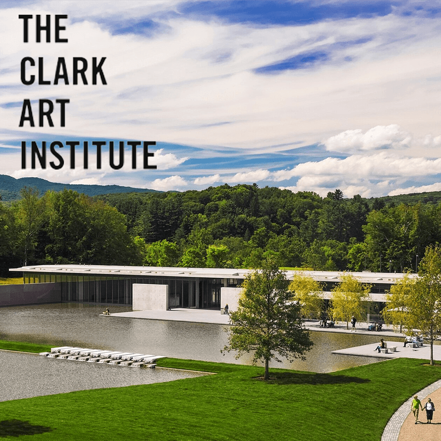 A modern art museum surrounded by lush greenery and water features under a blue sky.