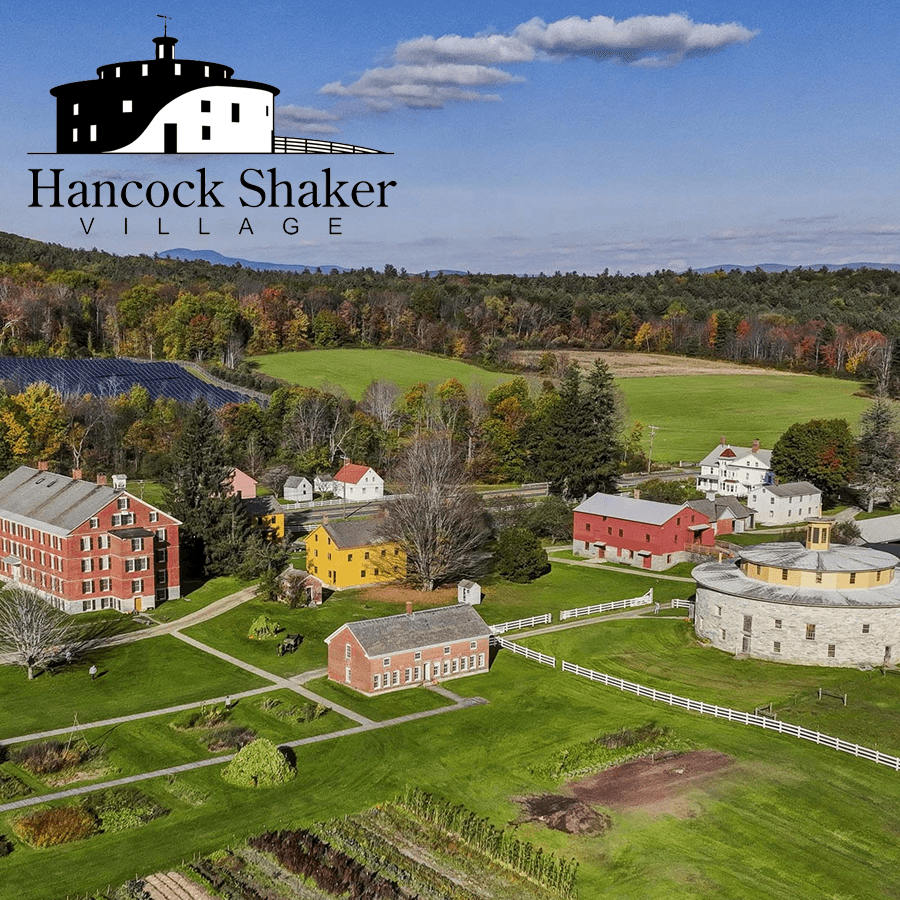 Aerial view of Hancock Shaker Village's historic buildings and surrounding landscapes.